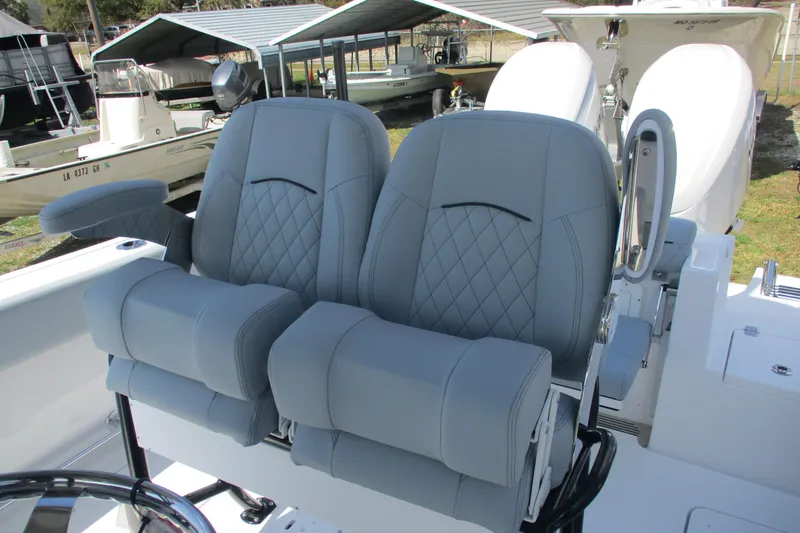 Slide: The Image of 2026 Sportsman Open 252 Center Console boat with dual cushioned seats. - 22