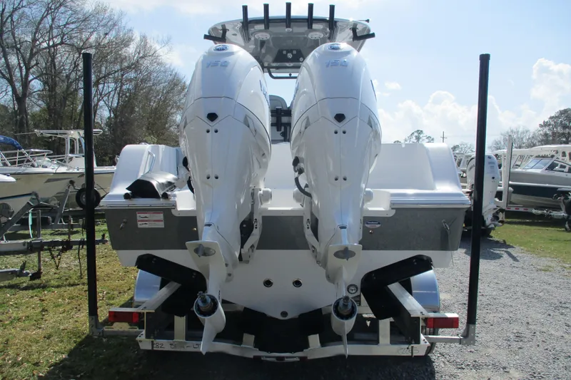 Slide: The Image of 2026 Sportsman Open 252 Center Console with dual outboard engines, rear view. - 3