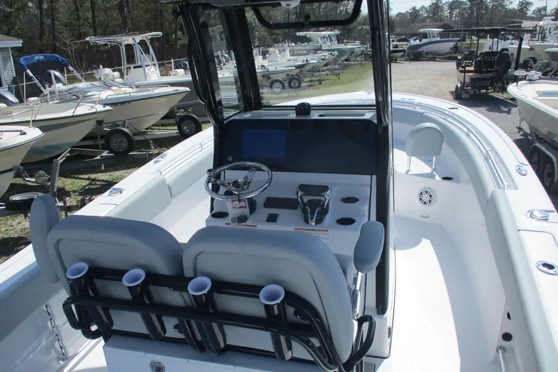Slide: The Image of 2026 Sportsman Open 252 Center Console boat interior with steering wheel and seating. - 4