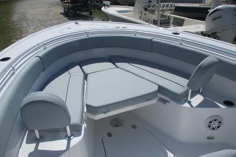 Slide: The Image of 2026 Sportsman Open 252 Center Console boat with cushioned seating area. - 6
