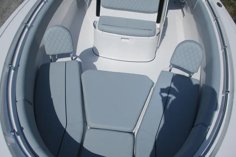 Slide: The Image of 2026 Sportsman Open 252 Center Console boat interior with gray cushioned seating. - 7