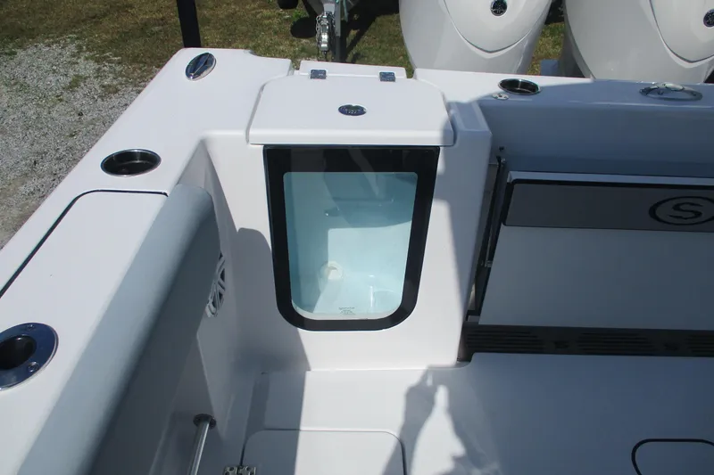 Slide: The Image of 2026 Sportsman Open 252 Center Console boat interior with storage compartment. - 8
