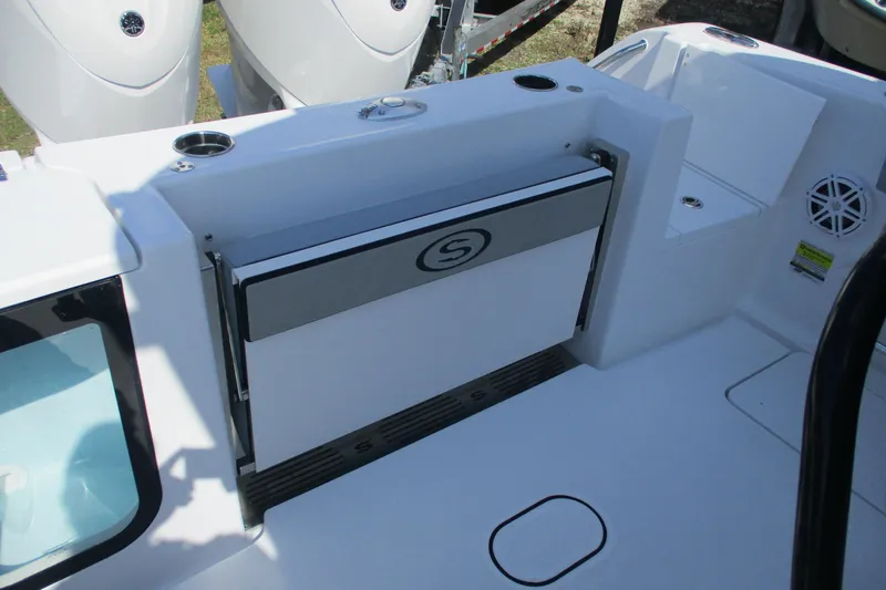 Slide: The Image of 2026 Sportsman Open 252 Center Console boat interior with foldable seat and storage. - 9