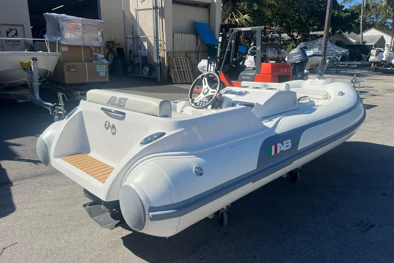 Slide: The Image of 2021 AB Inflatables ABJET 380 boat displayed outdoors, featuring sleek design and modern features. - 3