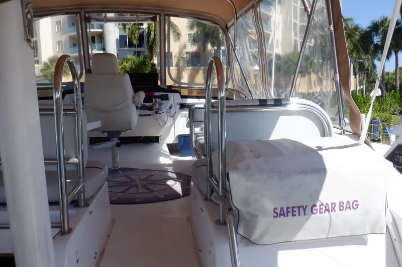 Slide: The Image of Interior view of 2002 Mainship 430 Trawler with safety gear bag and helm station. - 19