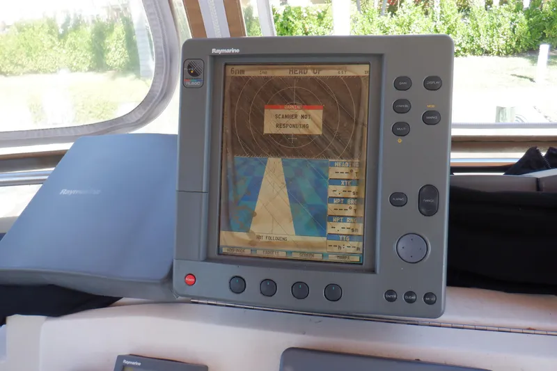 Slide: The Image of Raymarine navigation system on 2002 Mainship 430 Trawler, displaying "Scanner Not Responding" message. - 26