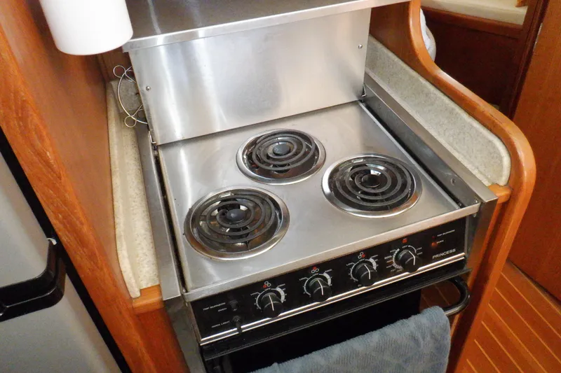 Slide: The Image of Stainless steel stove in 2002 Mainship 430 Trawler kitchen area. - 53