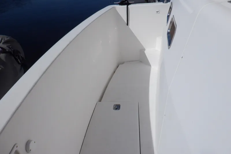 Slide: The Image of 2002 Mainship 430 Trawler deck with white finish and sleek design. - 8