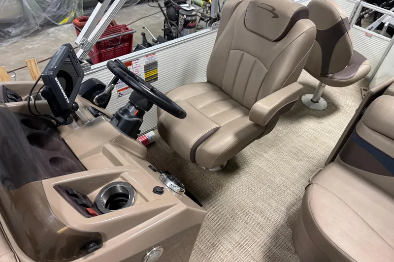 Slide: The Image of Interior of 2020 Bennington SX 22 SLX boat with steering console and seating. - 11