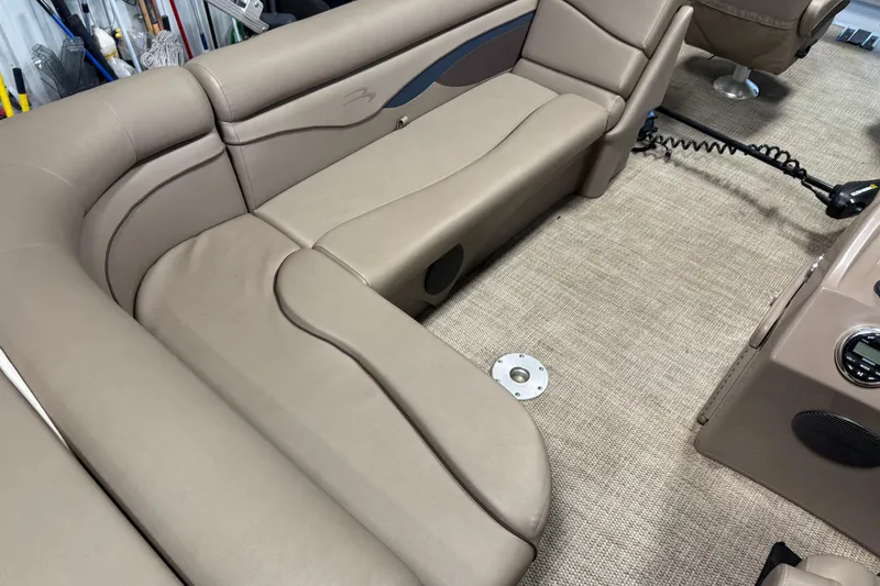 Slide: The Image of 2020 Bennington SX 22 SLX boat interior with beige seating and carpeted flooring. - 16
