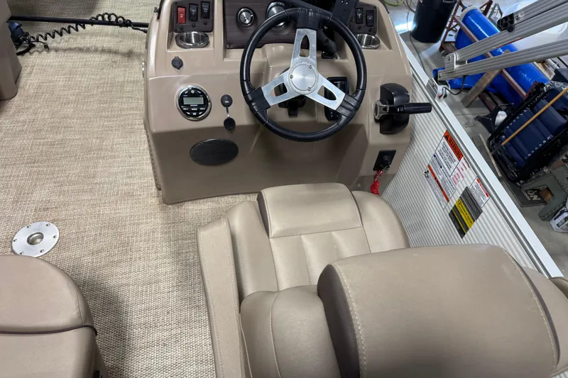 Slide: The Image of 2020 Bennington SX 22 SLX boat interior with steering wheel and control panel. - 17