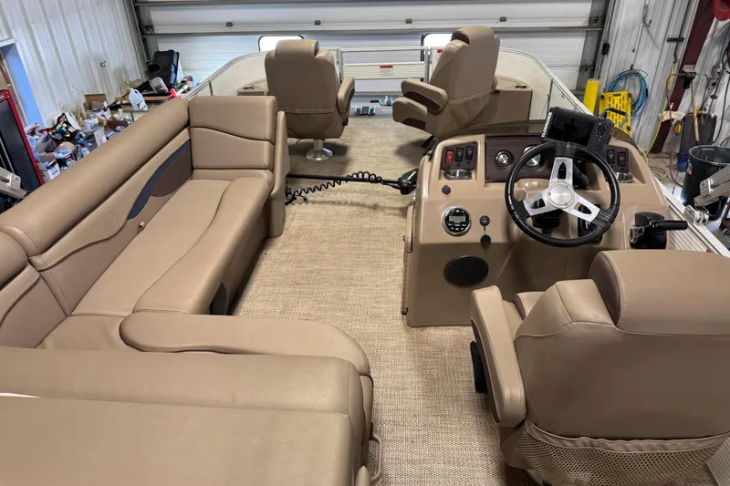 Slide: The Image of 2020 Bennington SX 22 SLX pontoon boat interior with beige seating and steering console. - 20