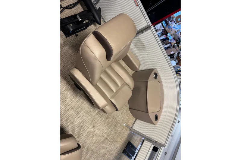 Slide: The Image of 2020 Bennington SX 22 SLX boat interior with beige seating and cup holders. - 7