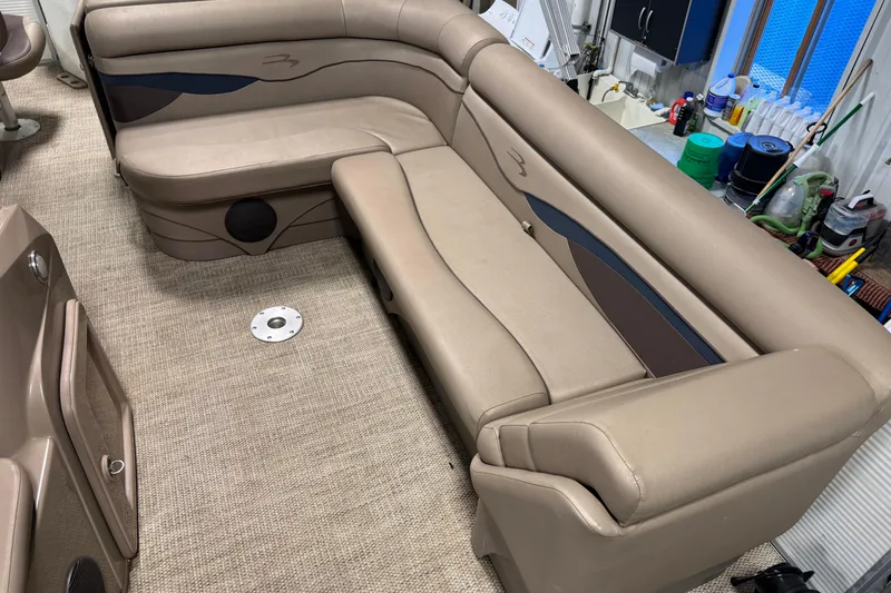 Slide: The Image of 2020 Bennington SX 22 SLX boat interior with beige seating and carpeted floor. - 8