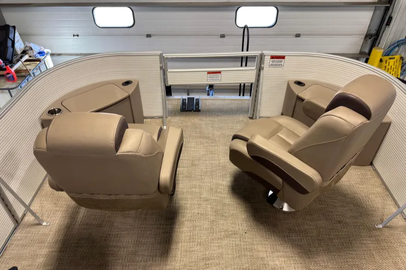 Slide: The Image of 2020 Bennington SX 22 SLX boat interior with beige seating and cup holders. - 9