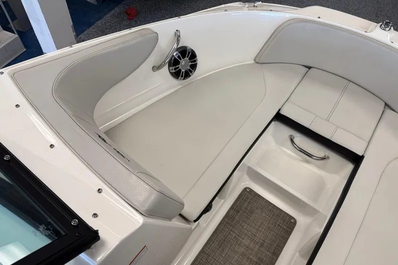 Slide: The Image of 2020 Sea Ray SPX 210 boat interior with white seating and speaker detail. - 4