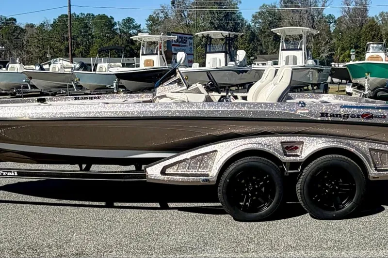 Slide: The Image of 2026 Ranger Z520R Ultra boat on trailer, parked in a marina. - 0