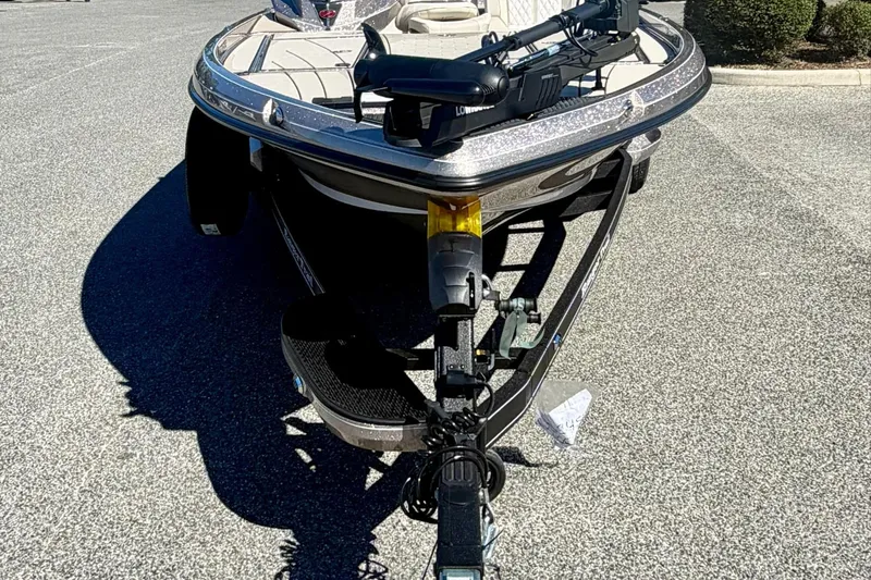 Slide: The Image of 2026 Ranger Z520R Ultra boat on trailer, parked on asphalt. - 2