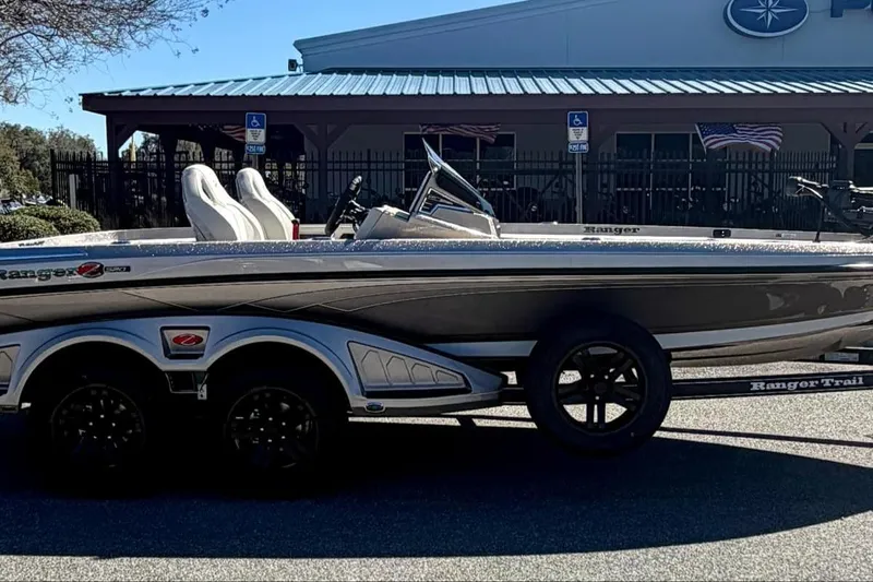Slide: The Image of 2026 Ranger Z520R Ultra boat on trailer, parked outdoors. - 4