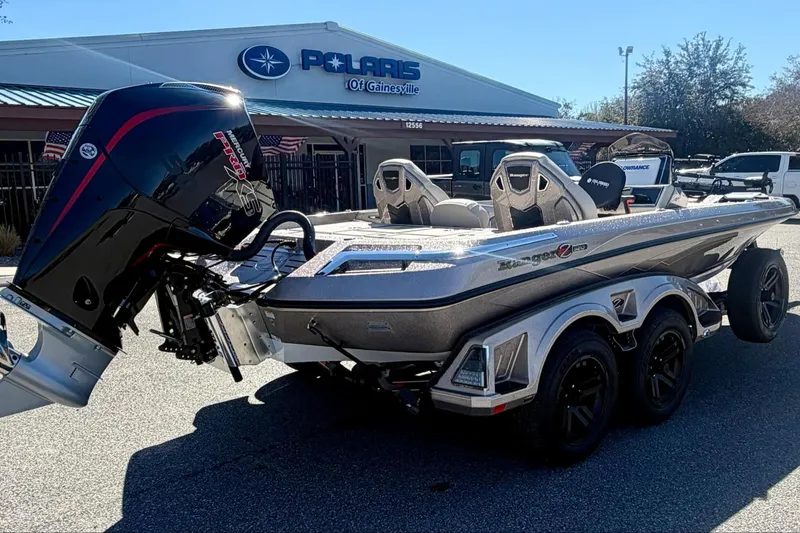 Slide: The Image of 2026 Ranger Z520R Ultra boat with powerful outboard motor at Polaris dealership. - 5