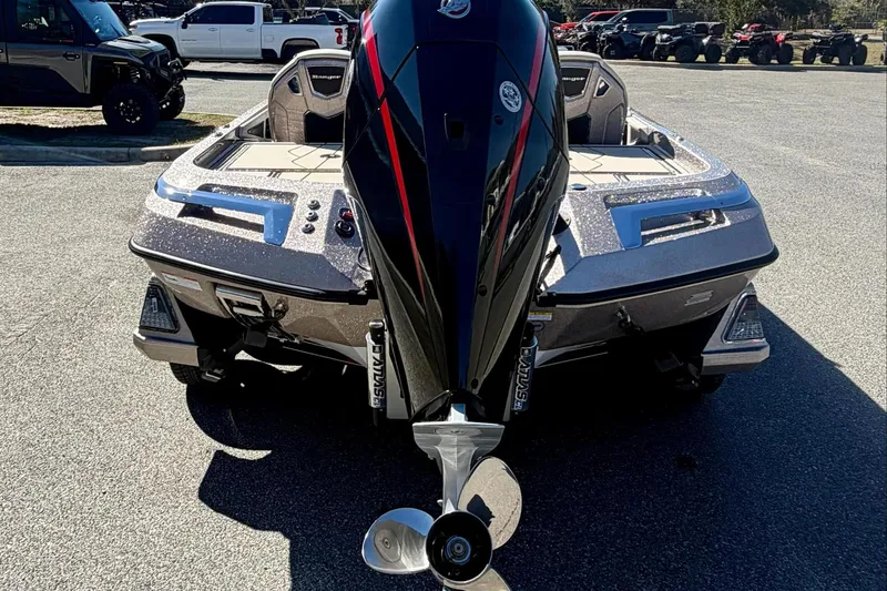 Slide: The Image of 2026 Ranger Z520R Ultra boat with powerful outboard motor, parked outdoors. - 6