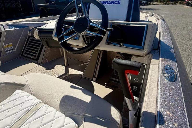 Slide: The Image of Interior of 2026 Ranger Z520R Ultra boat with steering wheel and control panel. - 8