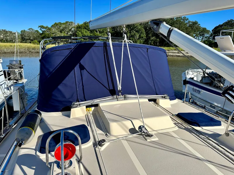 Slide: The Image of 2006 Island Packet 440 yacht with blue deck cover. - 22
