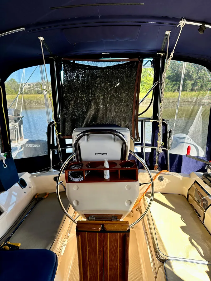 Slide: The Image of 2006 Island Packet 440 sailboat cockpit with steering wheel. - 7