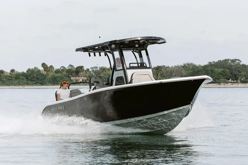 Slide: The Image of Manufacturer Provided Image: 2025 Sea Pro 245FLX Sandbar boat cruising on calm water. - 5
