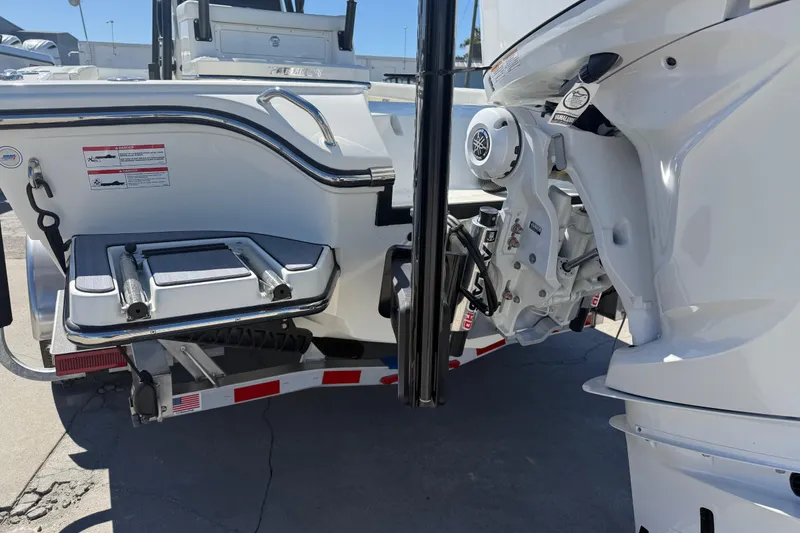 Slide: The Image of 2026 Pathfinder 2600 TRS boat stern with motor and trailer details. - 10