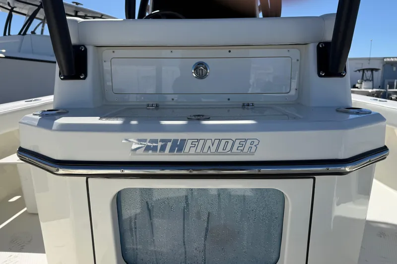 Slide: The Image of 2026 Pathfinder 2600 TRS boat console with logo and storage compartment. - 13
