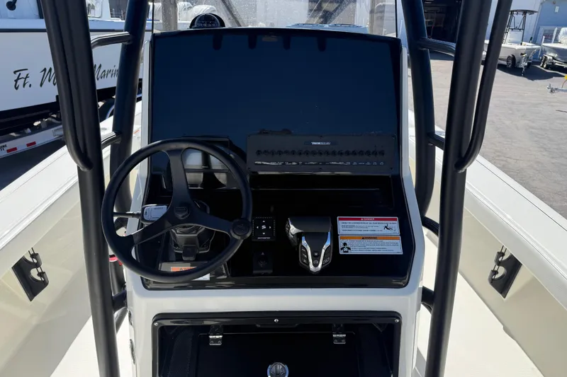 Slide: The Image of 2026 Pathfinder 2600 TRS boat console with steering wheel and control panel. - 14