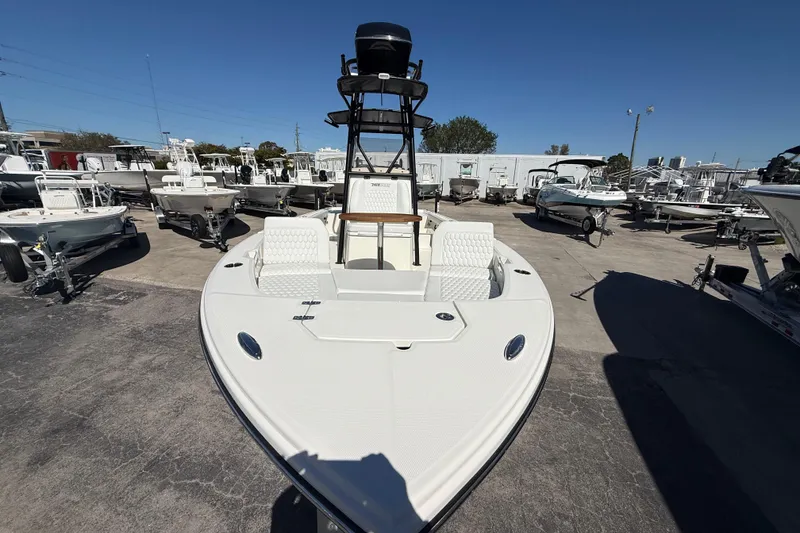 Slide: The Image of 2026 Pathfinder 2600 TRS boat displayed in a marina under clear blue skies. - 19