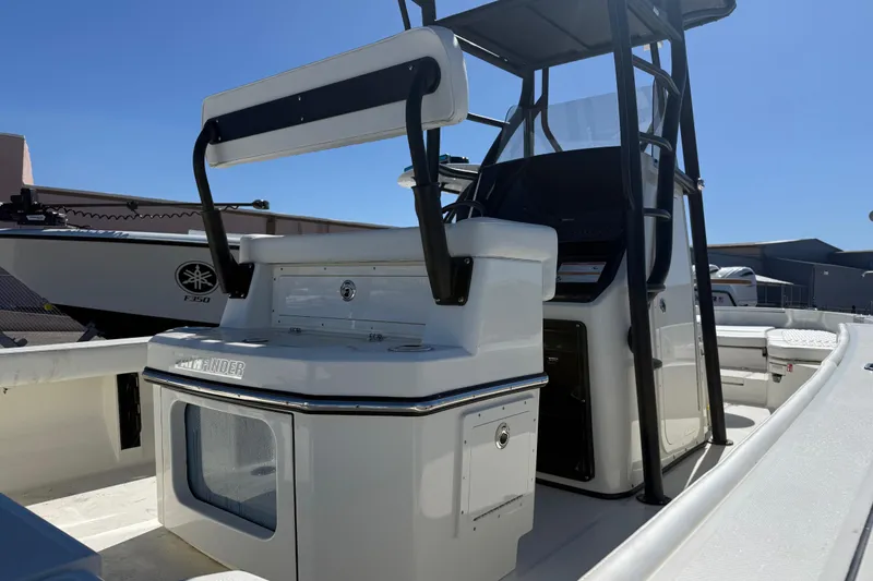 Slide: The Image of 2026 Pathfinder 2600 TRS boat interior with console and seating, under clear blue sky. - 5