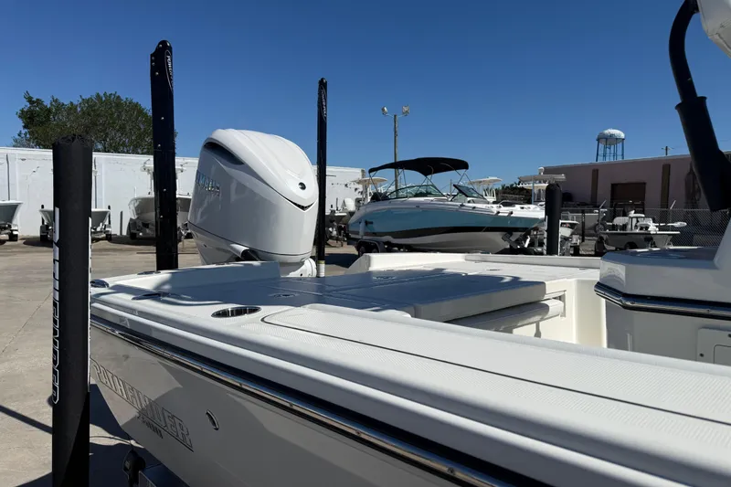 Slide: The Image of 2026 Pathfinder 2600 TRS boat with outboard motor in a marina setting. - 6