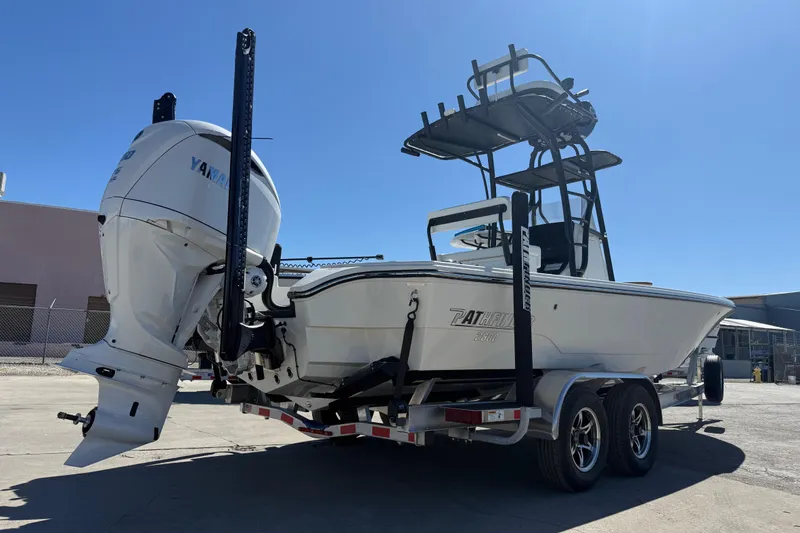 Slide: The Image of 2026 Pathfinder 2600 TRS boat on trailer, featuring powerful outboard motor. - 7