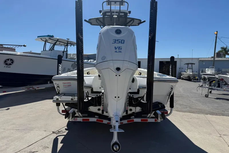 Slide: The Image of 2026 Pathfinder 2600 TRS boat with Yamaha 350 V6 engine, docked outdoors. - 9