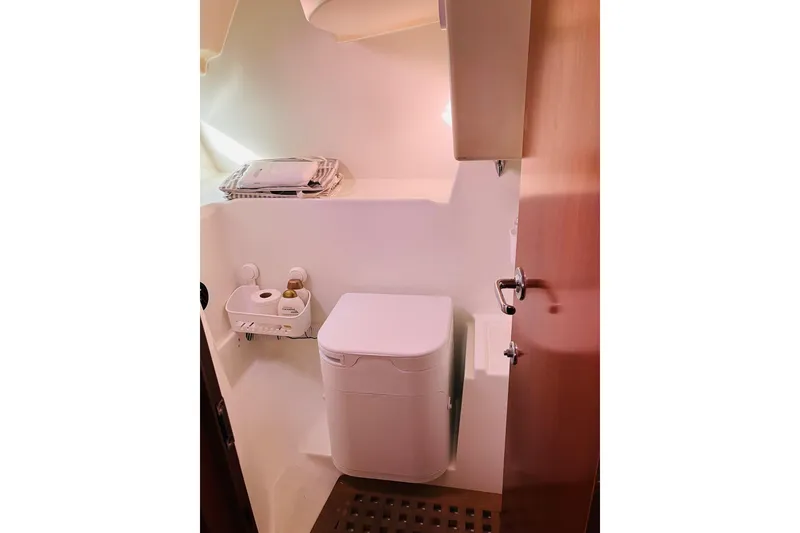 Slide: The Image of 1998 Beneteau 381 yacht bathroom interior with modern fixtures and compact design. - 44