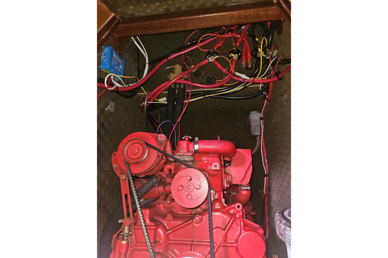Slide: The Image of Engine compartment of a 1998 Beneteau 381 sailboat with visible wiring and components. - 57