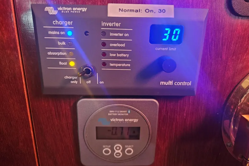 Slide: The Image of Interior of 1998 Beneteau Oceanis 381 sailboat with wooden flooring and cozy seating. - 35