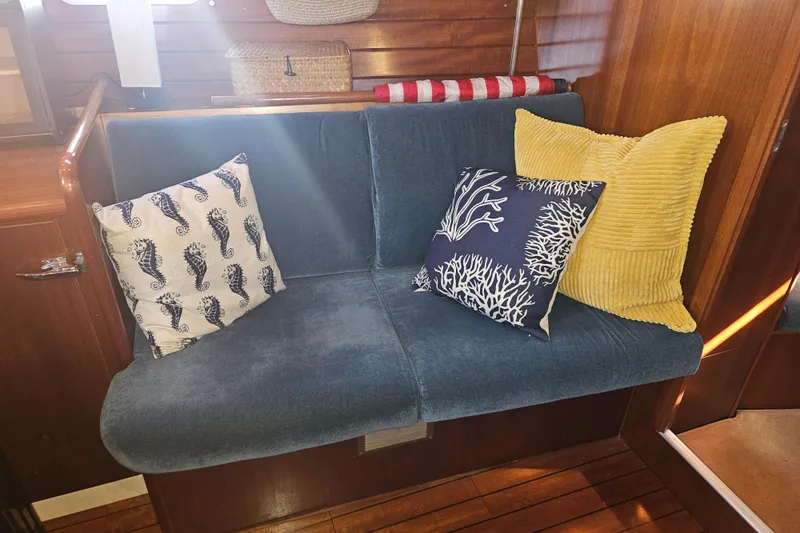 Slide: The Image of Interior of 1998 Beneteau Oceanis 381 sailboat with cozy seating and nautical decor. - 37