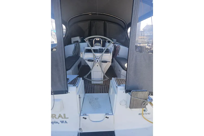 Slide: The Image of Cozy cabin interior of 1998 Beneteau Oceanis 381 with blue cushions and yellow pillow. - 45