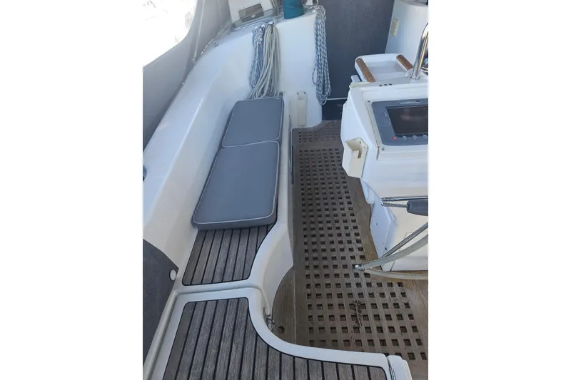 Slide: The Image of Interior of 1998 Beneteau 381 sailboat with wooden cabinetry and seating. - 48