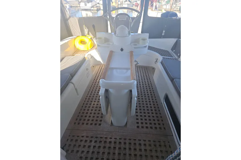 Slide: The Image of Wooden interior detail of a 1998 Beneteau 381 sailboat with cushioned seating. - 50