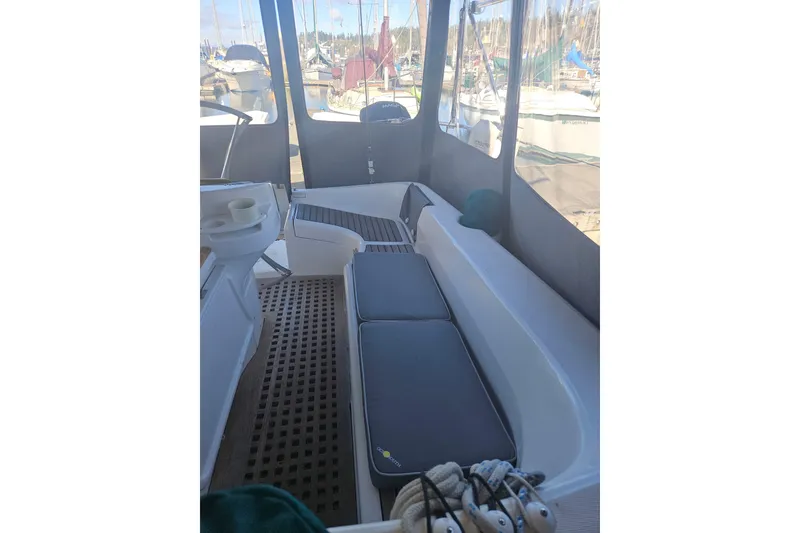 Slide: The Image of Interior of 1998 Beneteau Oceanis 381 sailboat, featuring a compact bathroom and wooden accents. - 51