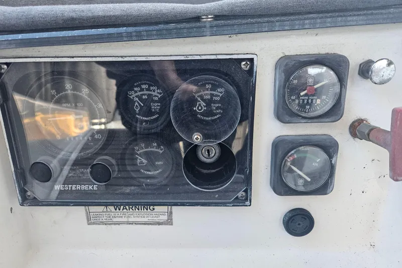 Slide: The Image of Interior view of a 1998 Beneteau 381 sailboat cockpit with seating and nautical equipment. - 58