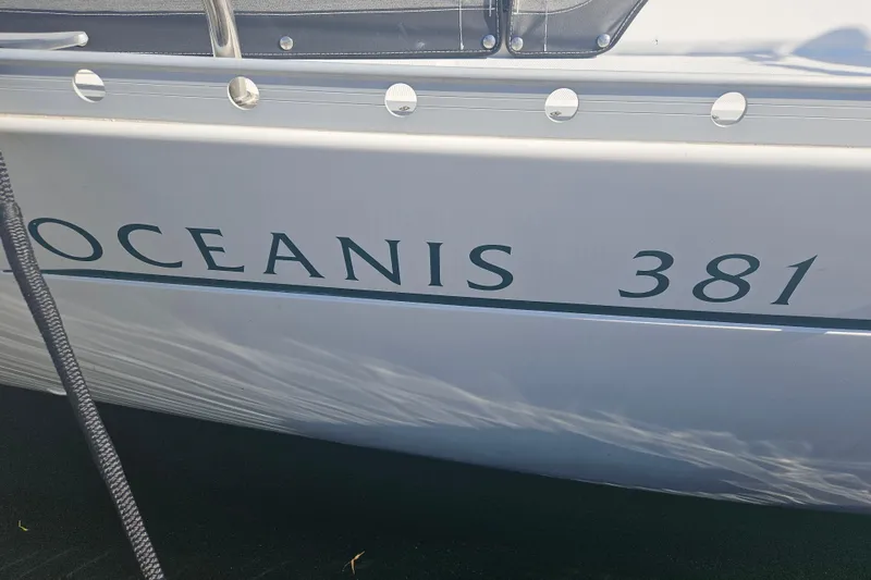 Slide: The Image of Beneteau Oceanis 381 sailboat, 1998 model, side view with name visible. - 6