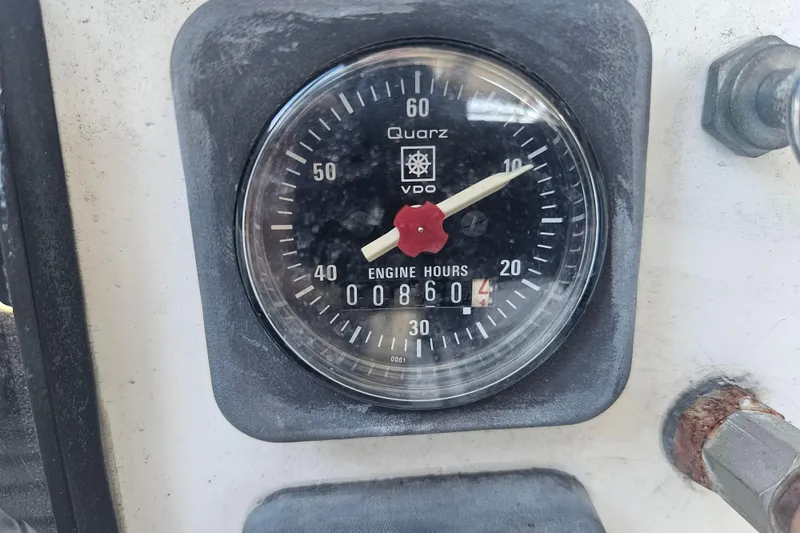 Slide: The Image of Cockpit of a 1998 Beneteau 381 sailboat with wooden flooring and steering wheel. - 61