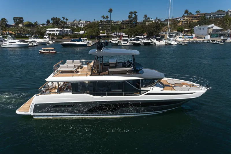 Slide: The Image of 2024 Prestige X60 yacht cruising in a marina, surrounded by other boats. - 0