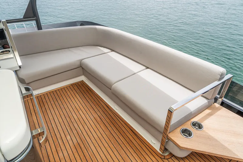 Slide: The Image of Luxurious seating area on 2024 Prestige X60 yacht with elegant wooden deck. - 12